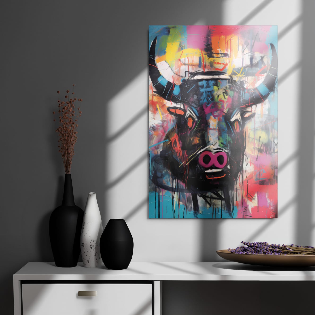 "Graffiti Bull" glossy metal wall art poster 20"x30" on a dark modern wall above a cabinet with minimalist vases, window-light shadows highlighting the colorful bull graffiti portrait by GiveMeMood