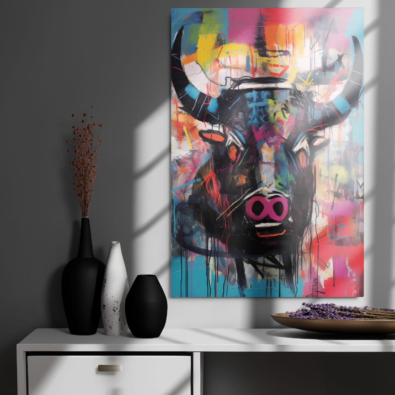 "Graffiti Bull" glossy metal wall art poster 24"×36" on a dark modern wall above a cabinet with minimalist vases, window-light shadows highlighting the colorful bull graffiti portrait by GiveMeMood