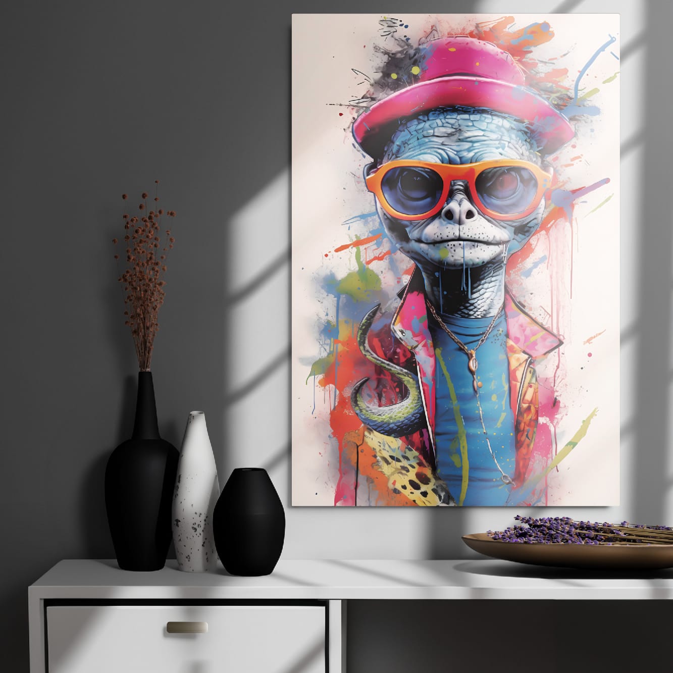 "Reptile Swagger" glossy metal poster 24"x36" on modern gray wall above console decor with window-light shadows, bold street-art reptile metal print with pink hat, orange sunglasses, and paint splashes, by GiveMeMood